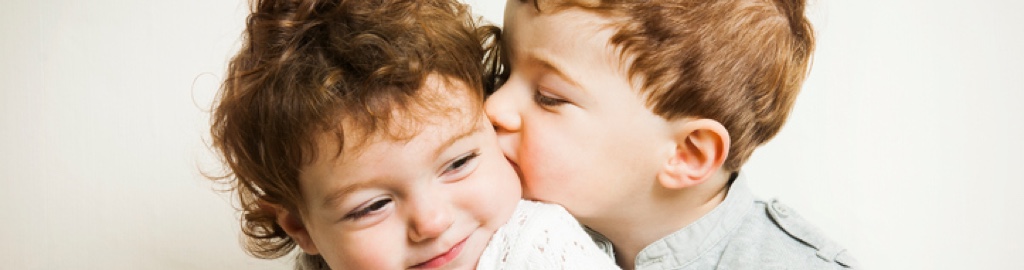Two children snuggling