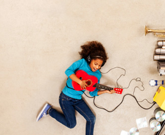 Child playing a guitar