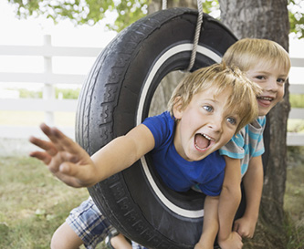 Children in a tire swing